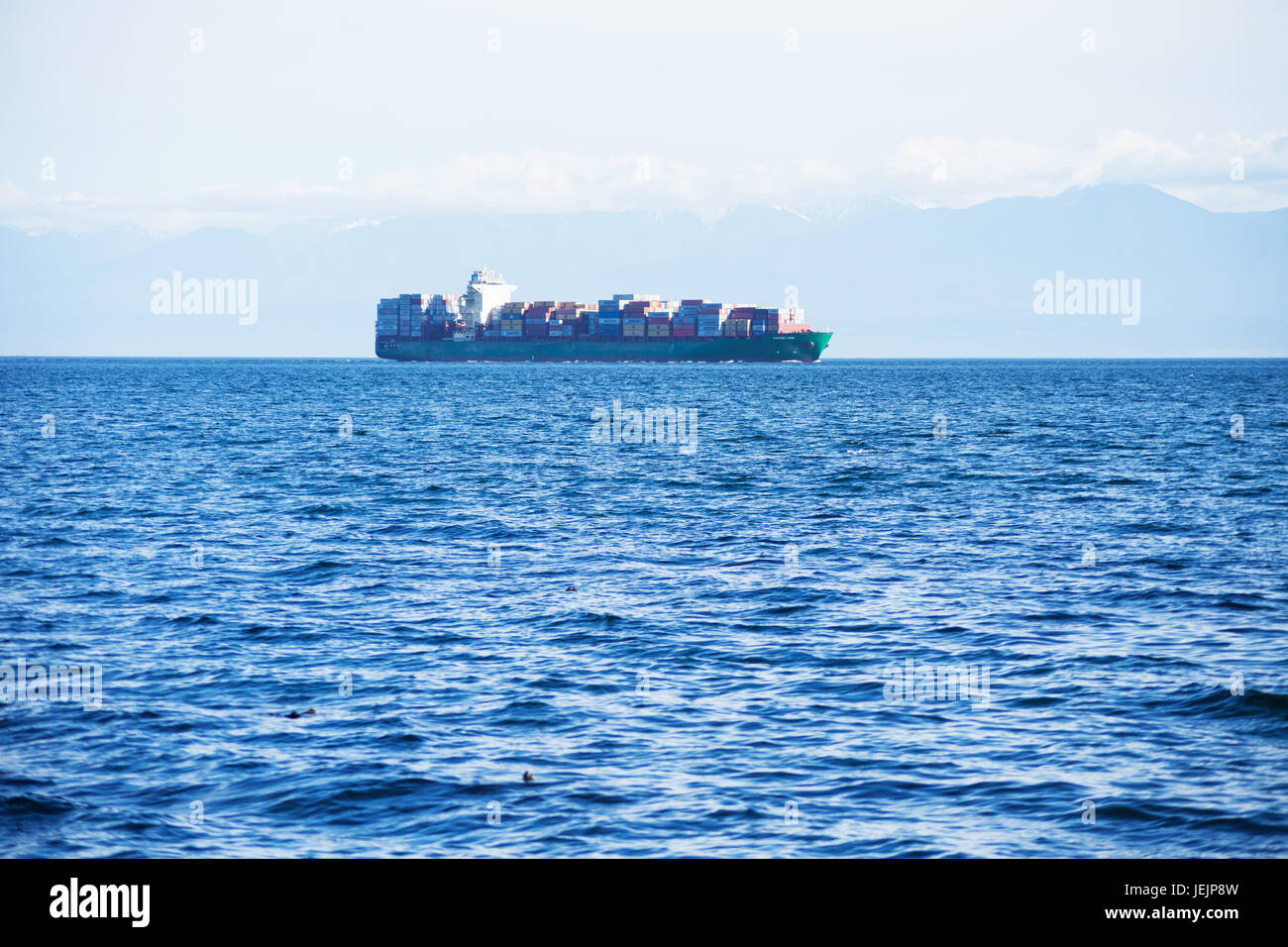 Cargo ship carrying containers in Juan de Fuca Strait. Victoria BC