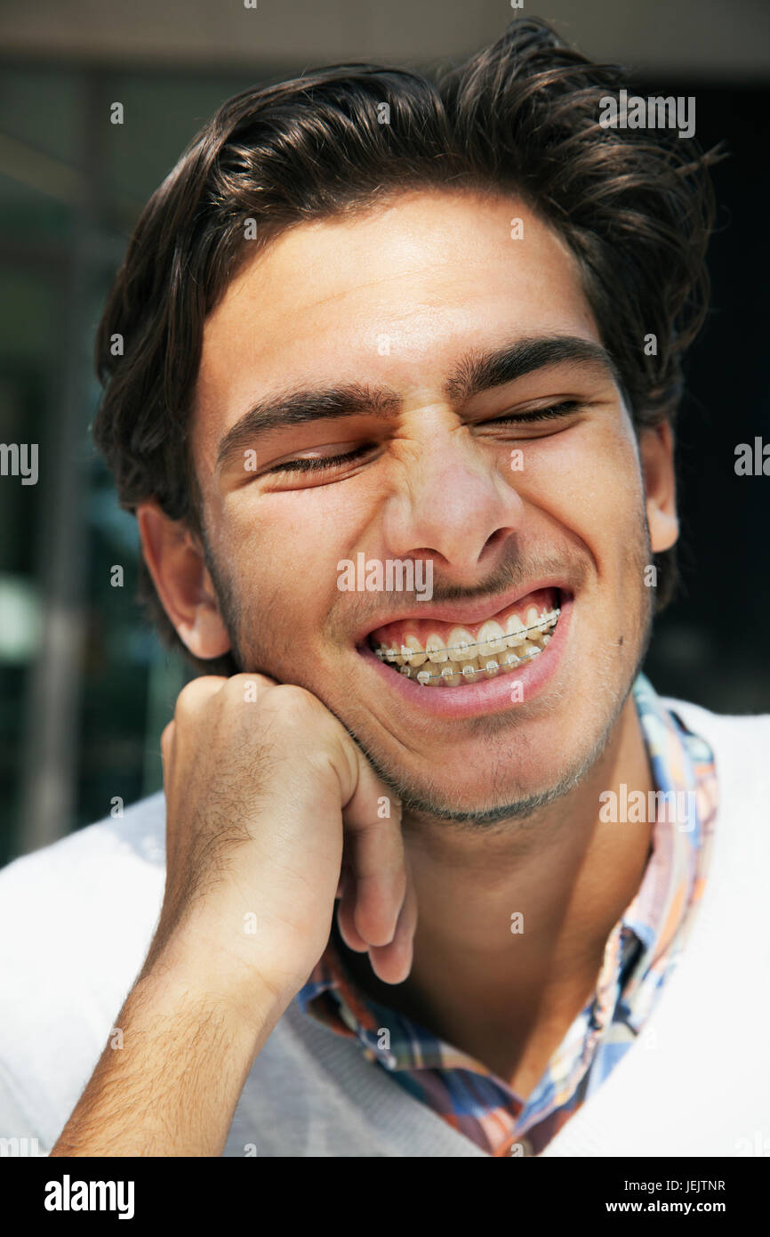 Portrait of smiling young man Stock Photo - Alamy