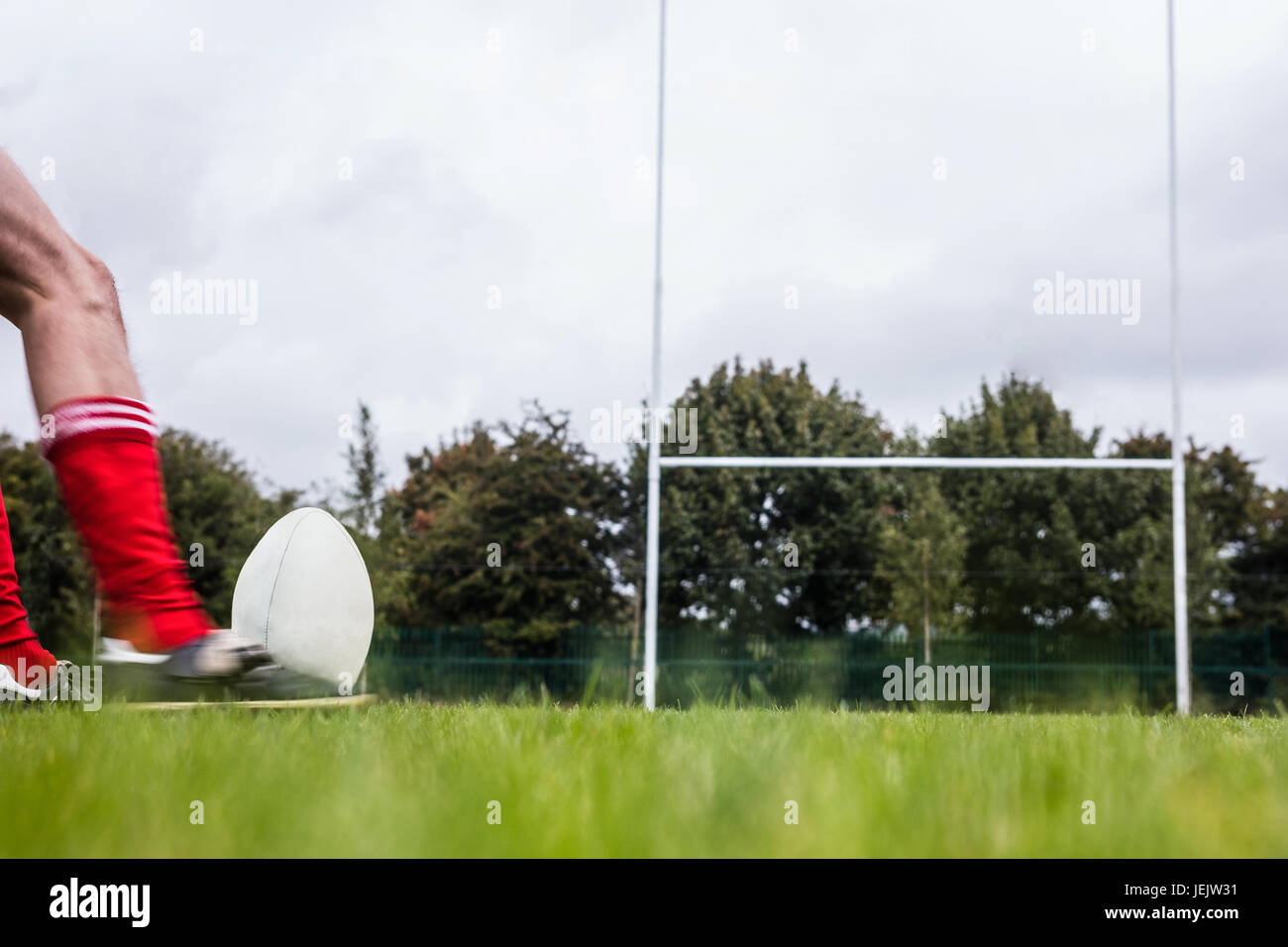 Rugby player kicking the ball Stock Photo Alamy