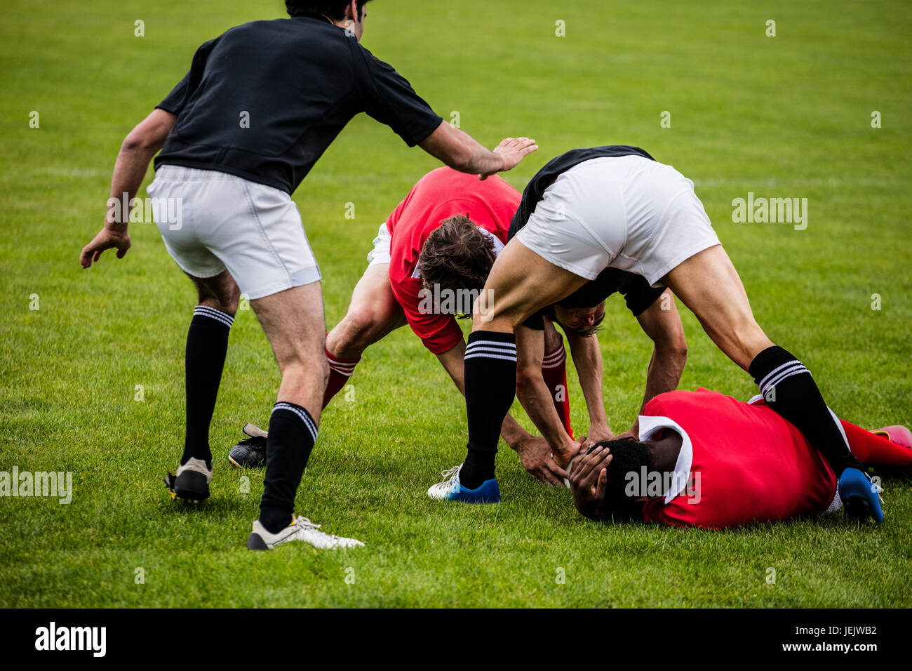 Rugby players tackling during game Stock Photo Alamy