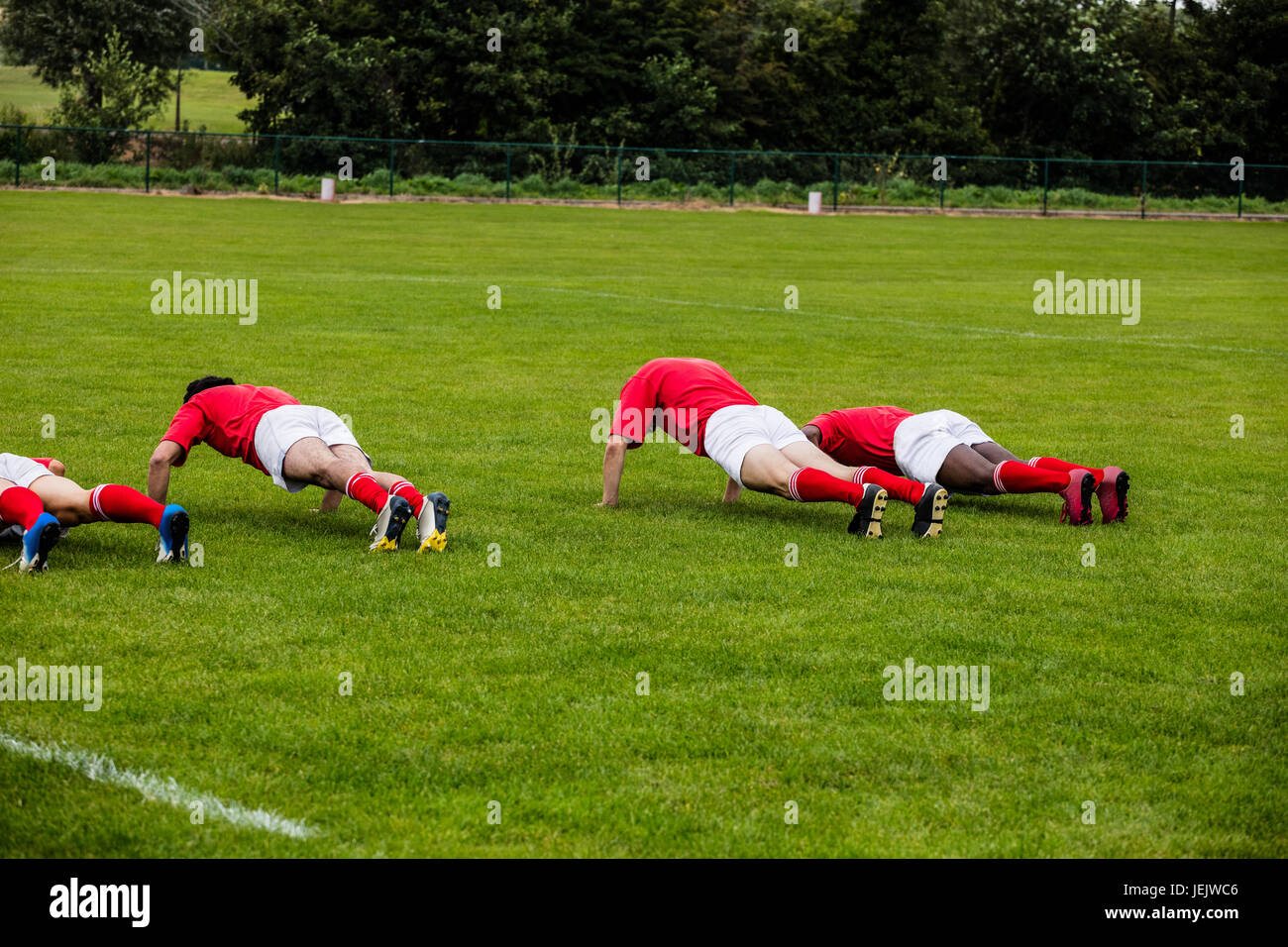 Rugby players doing push ups Stock Photo Alamy
