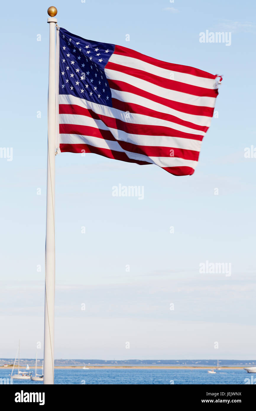 American flag against blue sky Stock Photo - Alamy