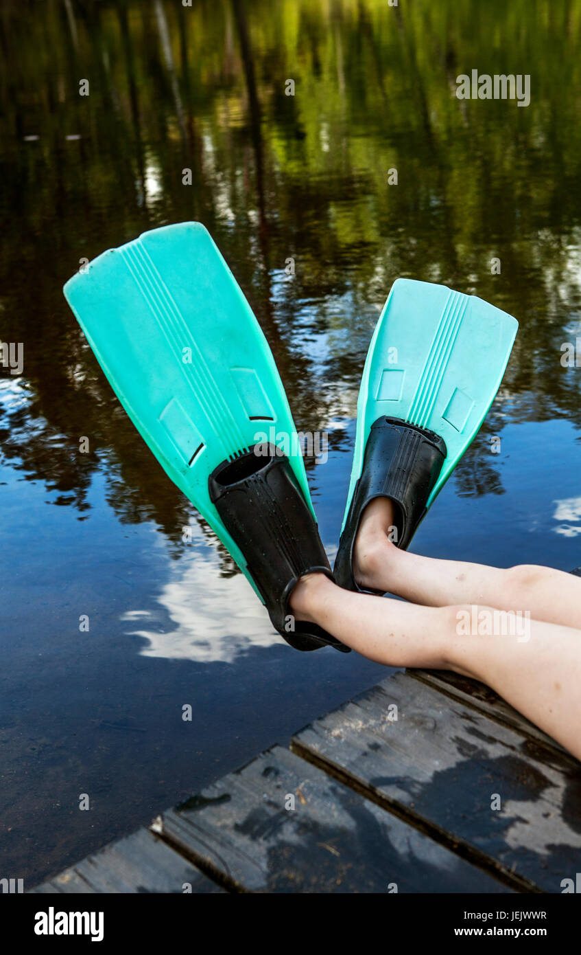 Child wearing flippers, low section Stock Photo Alamy