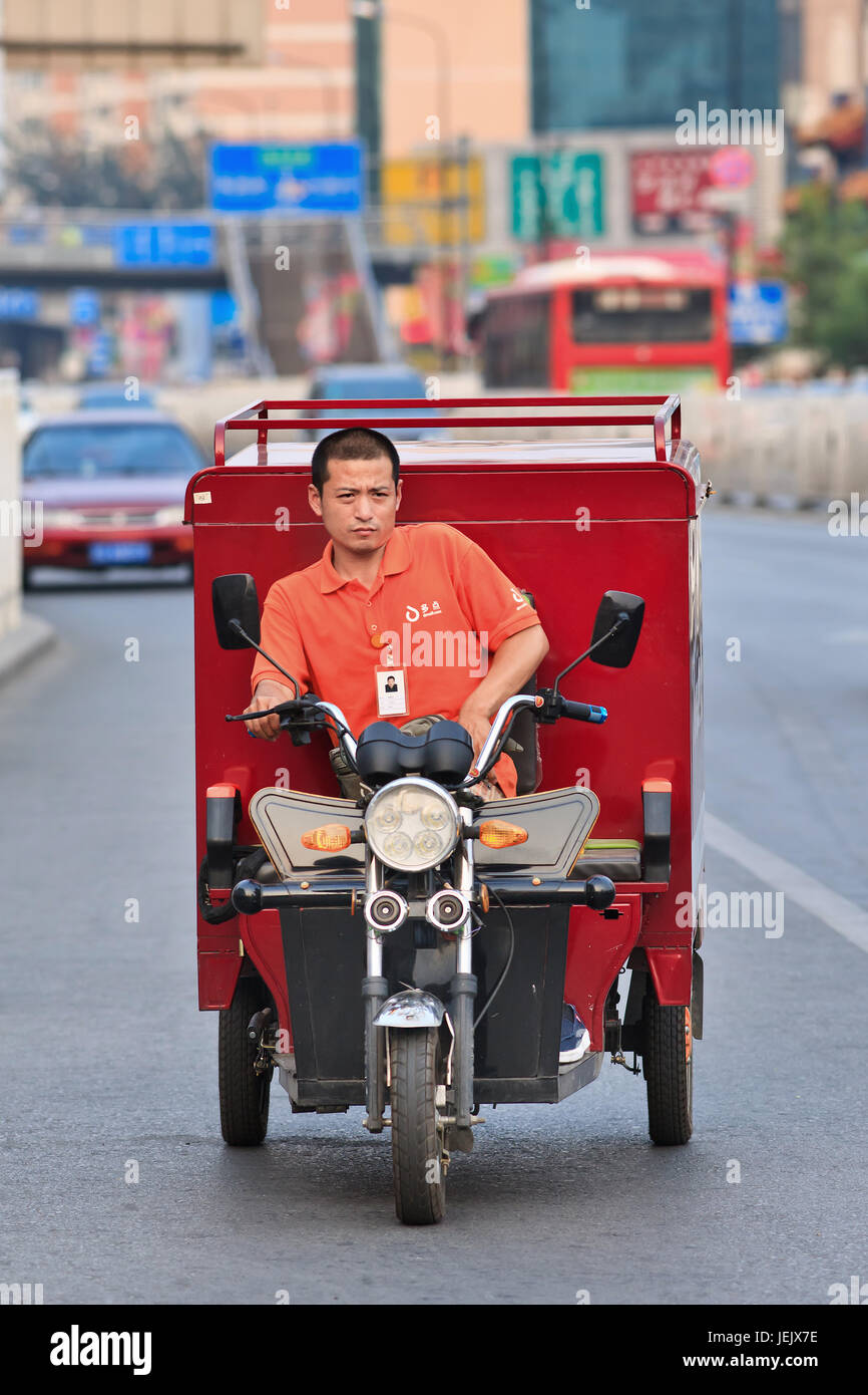 BEIJING-JULY 10, 2015. Courier delivery service bike. Thanks to the country’s e-commerce boom, China has more than 35,000 courier delivery services. Stock Photo