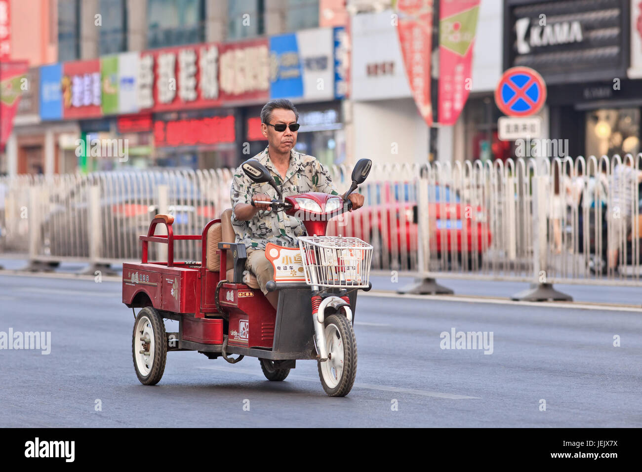 BEIJING-JULY 10, 2015. Electric freight bike. In a decade, e-bikes in China climbed from near zero to 150 million by 2015. Stock Photo