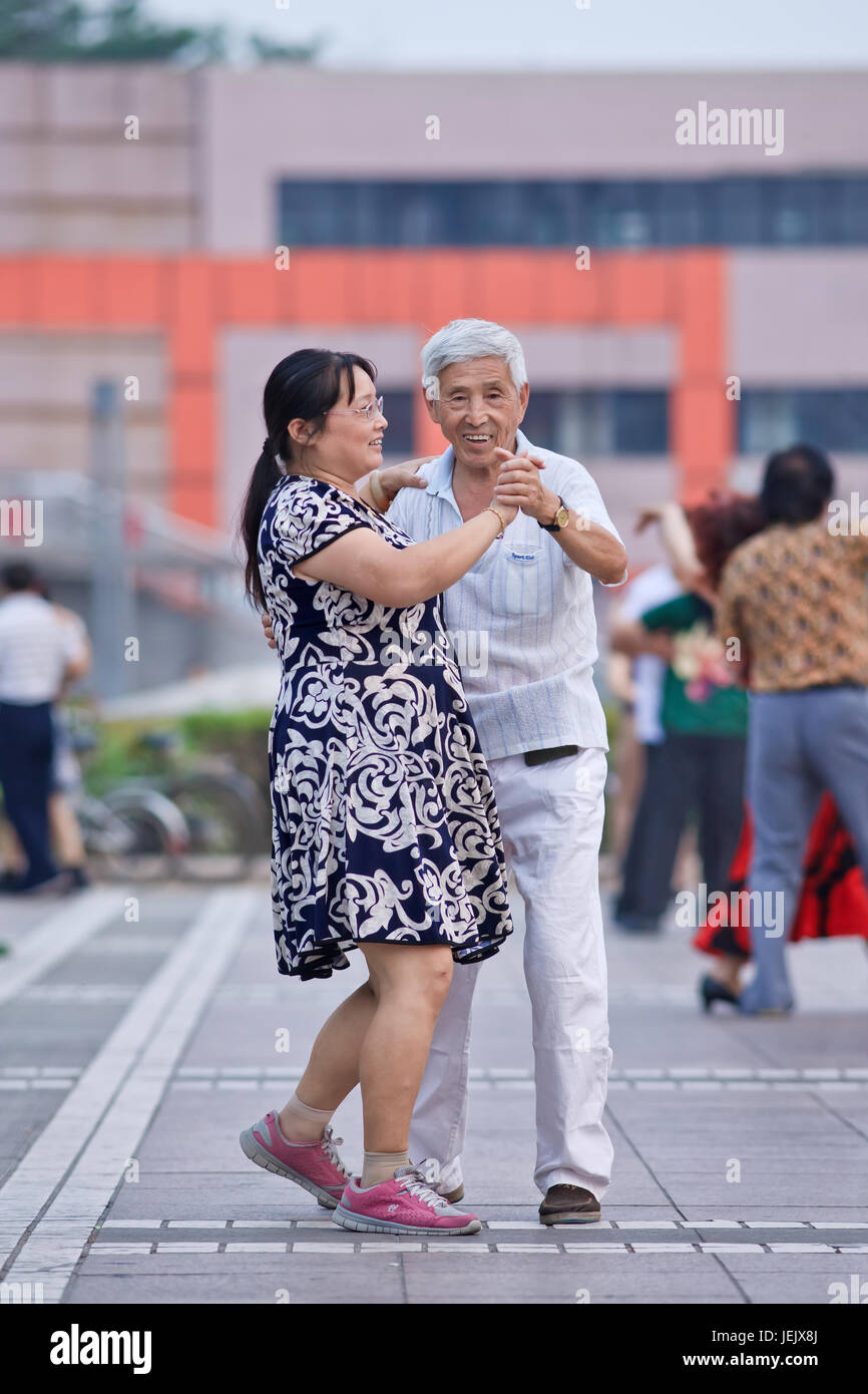 BEIJING-JULY 10, 2015. Collective square dancing is a very popular phenomenon in China and for many people a sort of recreation. Stock Photo