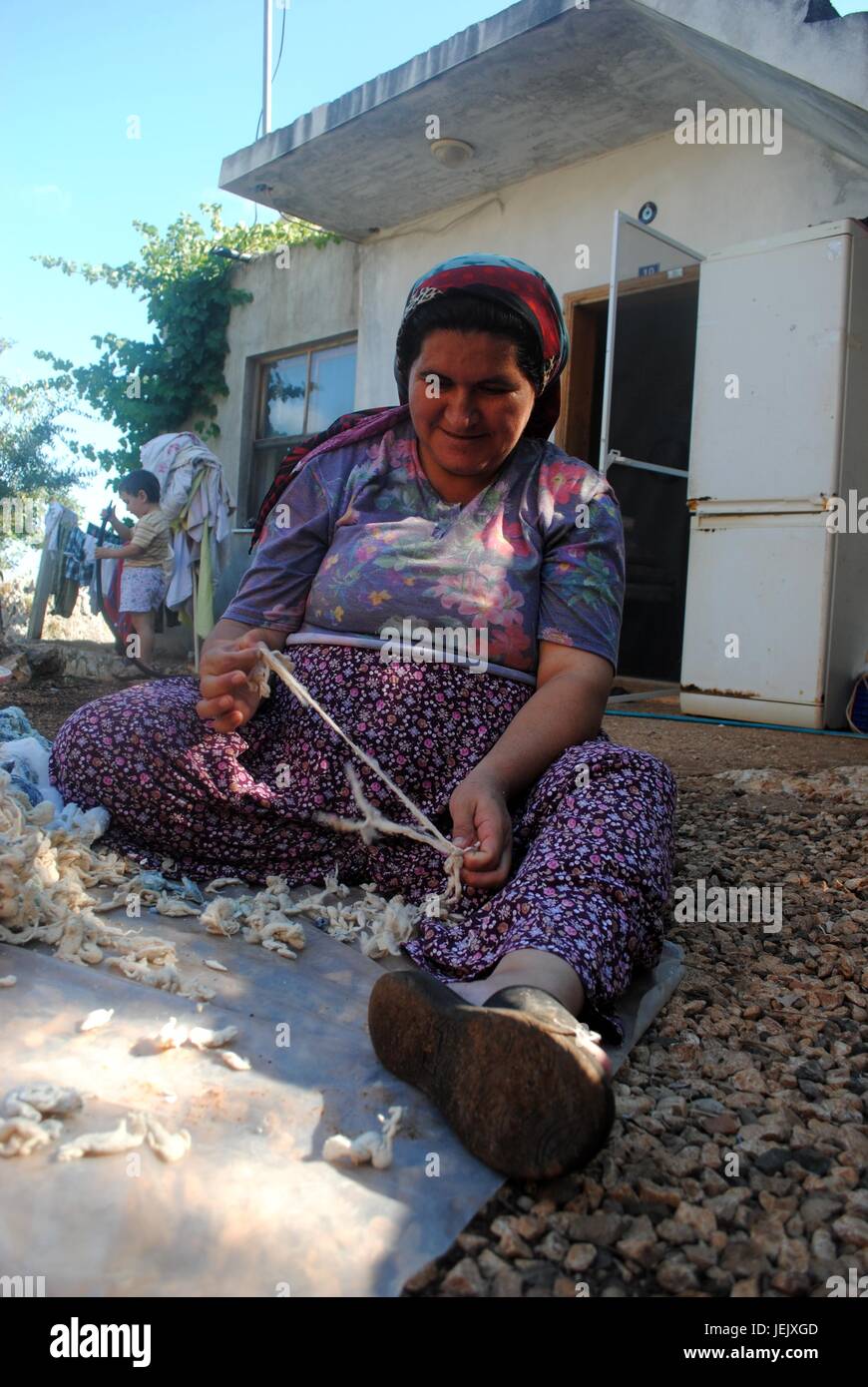 Turkish woman at work with cotton Stock Photo