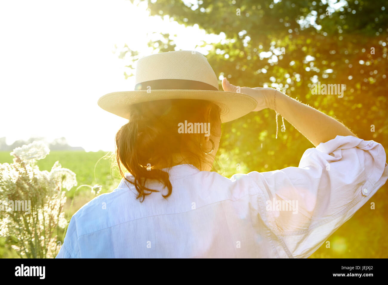 Back view woman wearing straw hi-res stock photography and images - Alamy