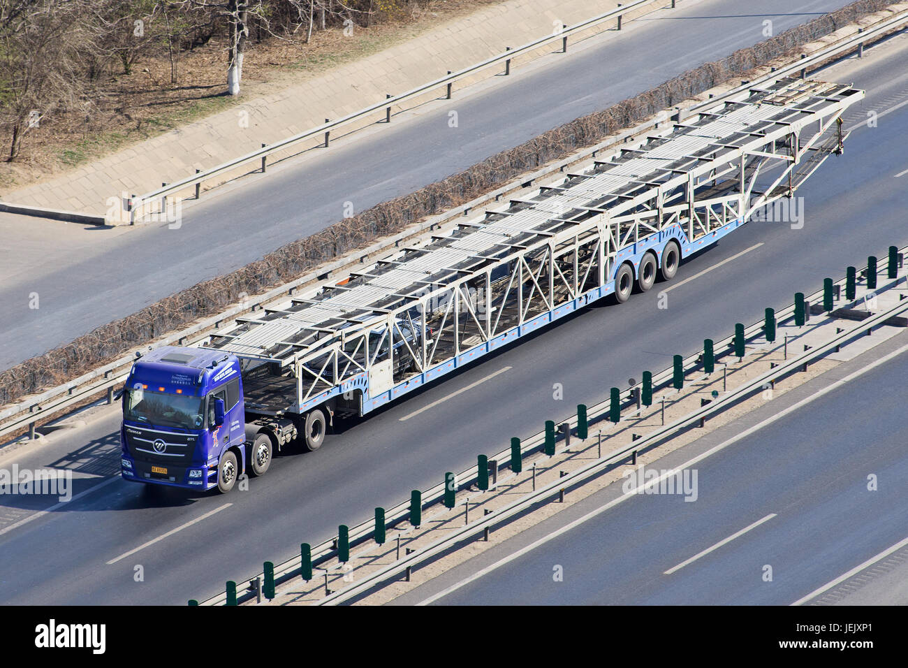 BEIJINGJUNE 30, 2015. Oversized car carrier. These illegal car