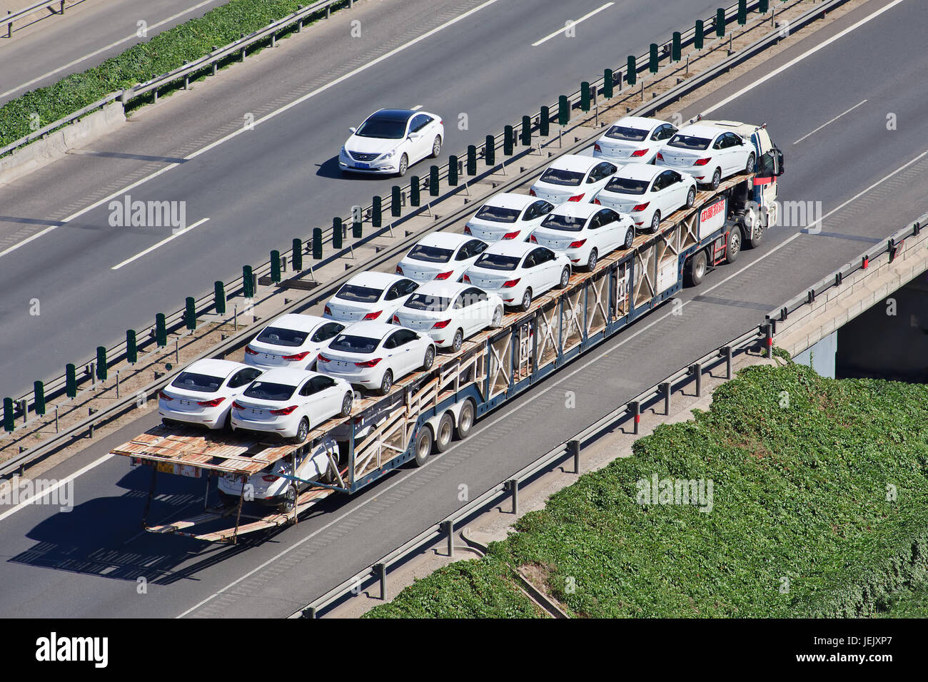 BEIJINGJUNE 30, 2015. Oversized car carrier. These illegal car