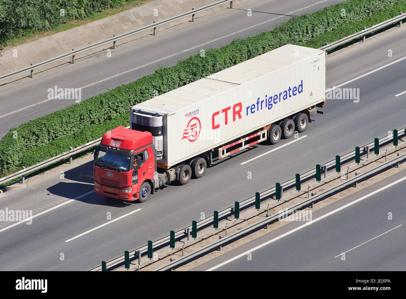 BEIJING-JUNE 30, 2015. FAW truck with CTR refrigerator container. CTR is a Canadian company specialized in refrigeration, heating and air conditioning. Stock Photo