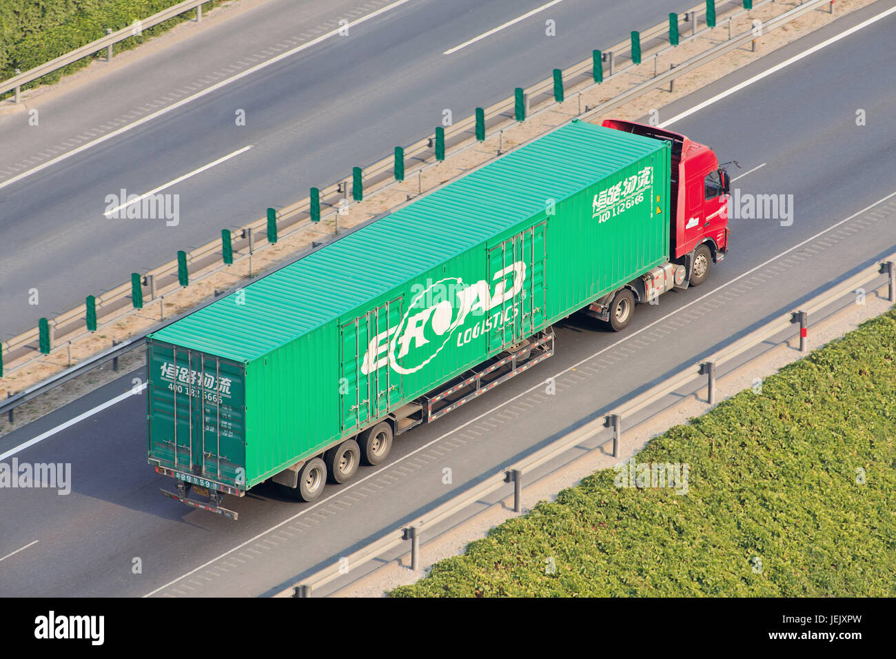 BEIJING-JULY 7, 2015. Chinese truck with Eroad Logistics container. ERoad, founded in 1993, is a Chinese transport and logistics company. Stock Photo