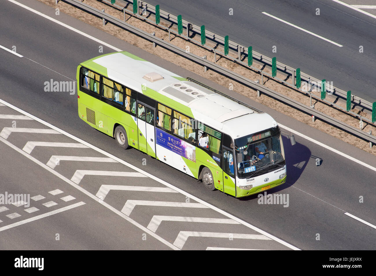 BEIJING-SEPTEMBER 12, 2015. Long distance Bus on the expressway. Beijing has over 800 bus routes, downtown buses are  operating from 05:30 until 23:00. Stock Photo