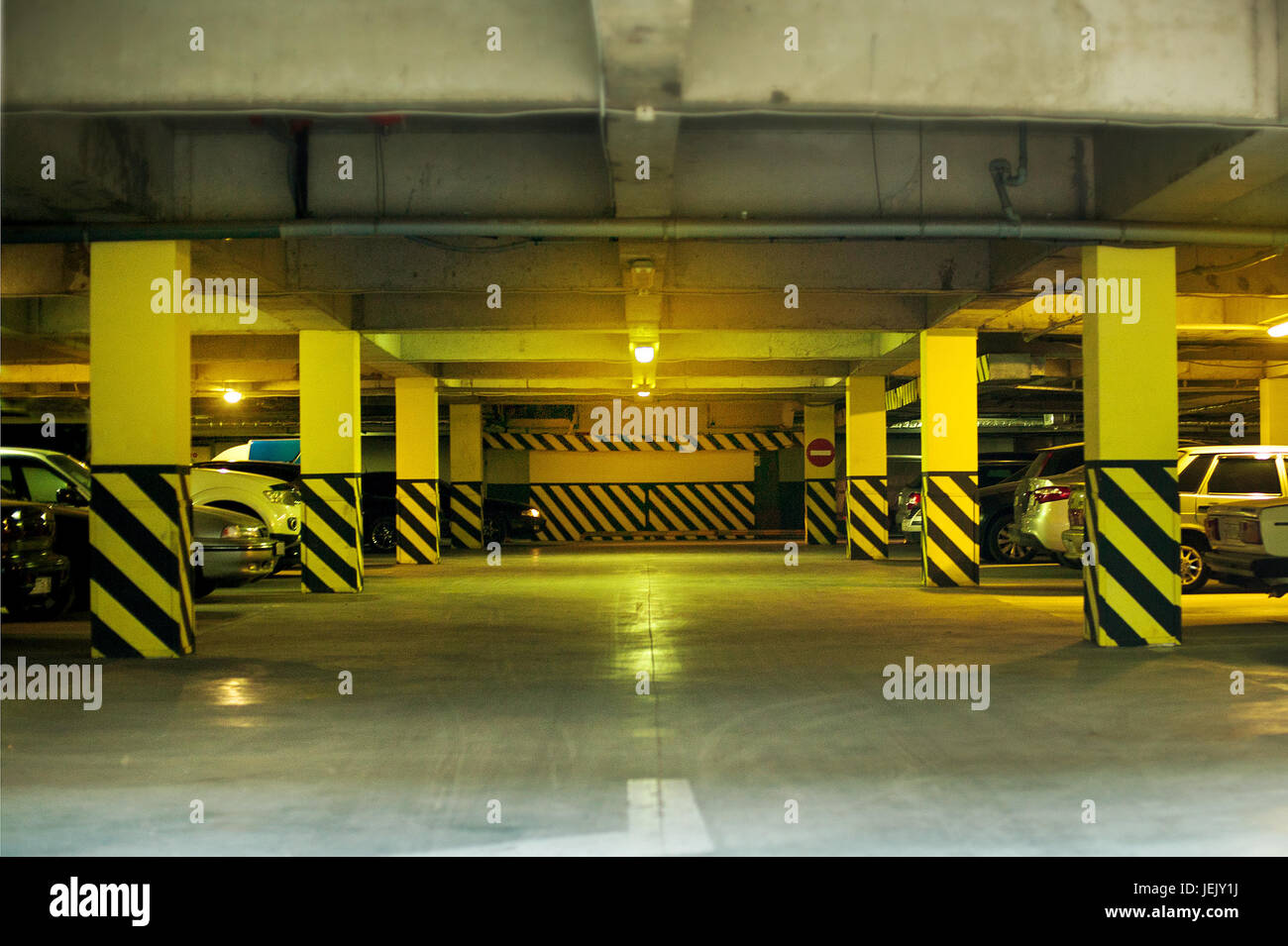 Underground parking garage shallow DOF color toned image Stock Photo