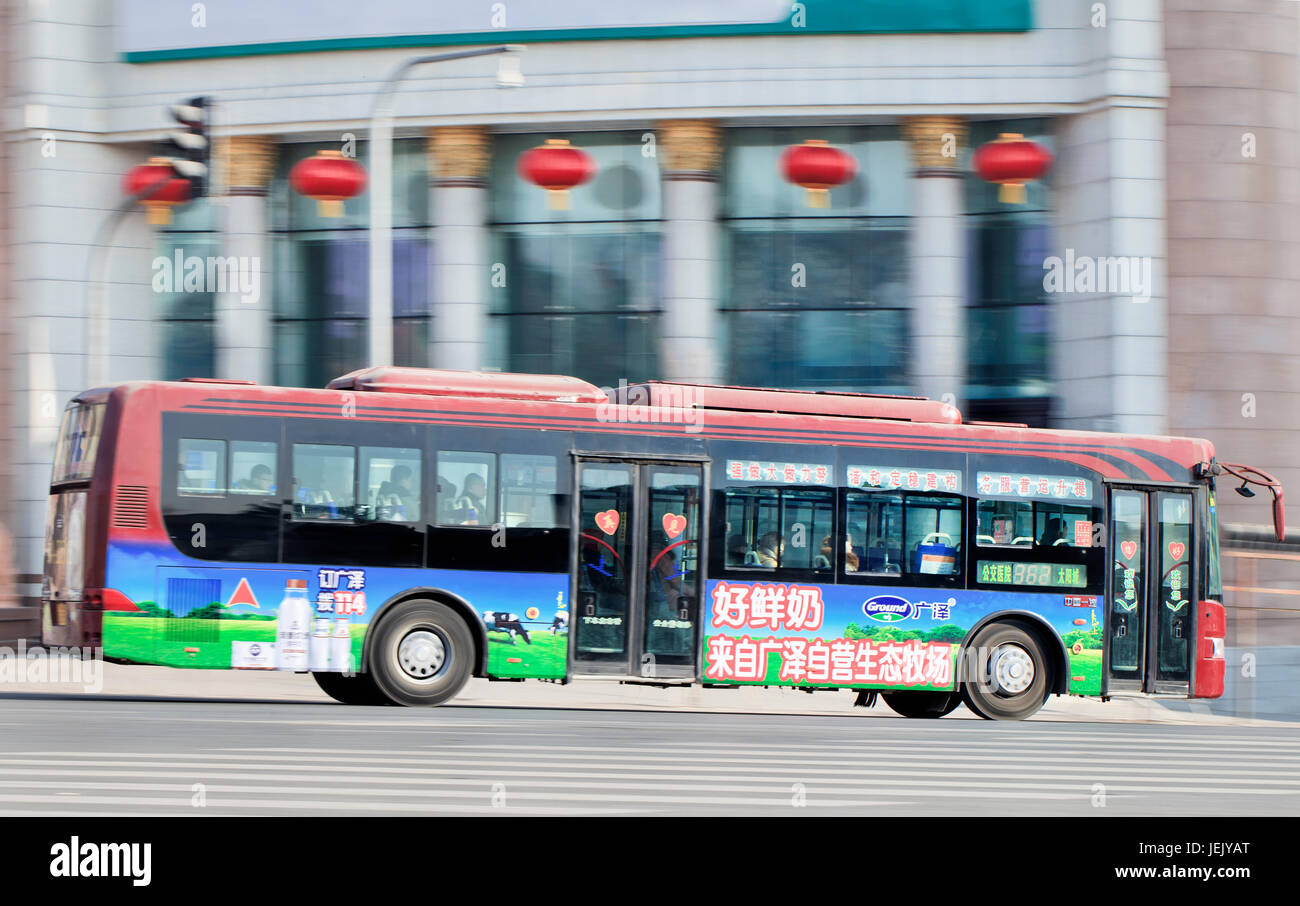 CHANGCHUN – JAN. 31, 2014. Bus on the road. Cheapest way to travel around Changchun is by city bus which is centered around many bus routes. Stock Photo