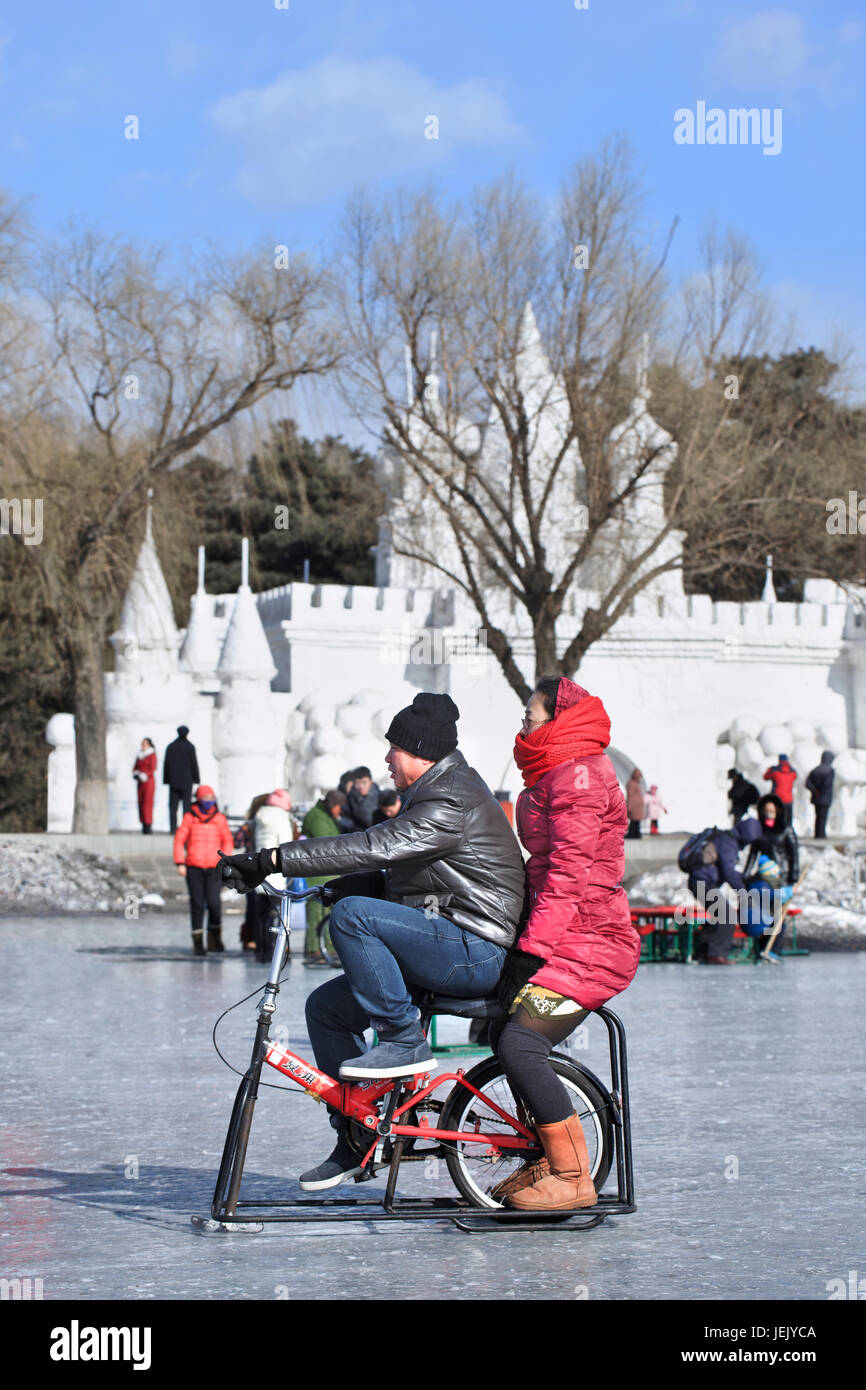 CHANGCHUN – FEBR. 4, 2014. People have fun on the ice in Nanhu Park Changchun, capital of northeast Jilin Province. Stock Photo