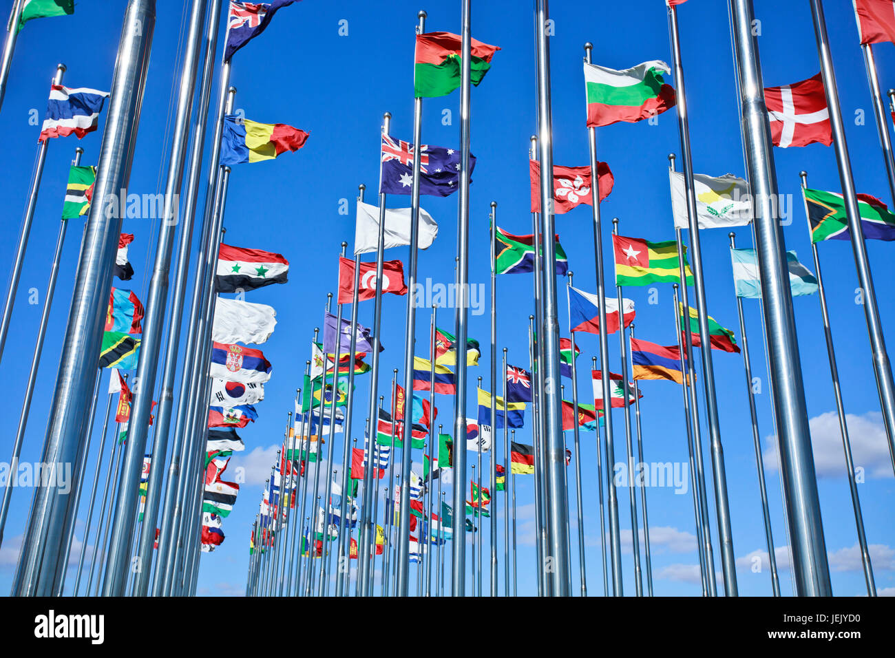 Collection of international flags against a blue sky Stock Photo