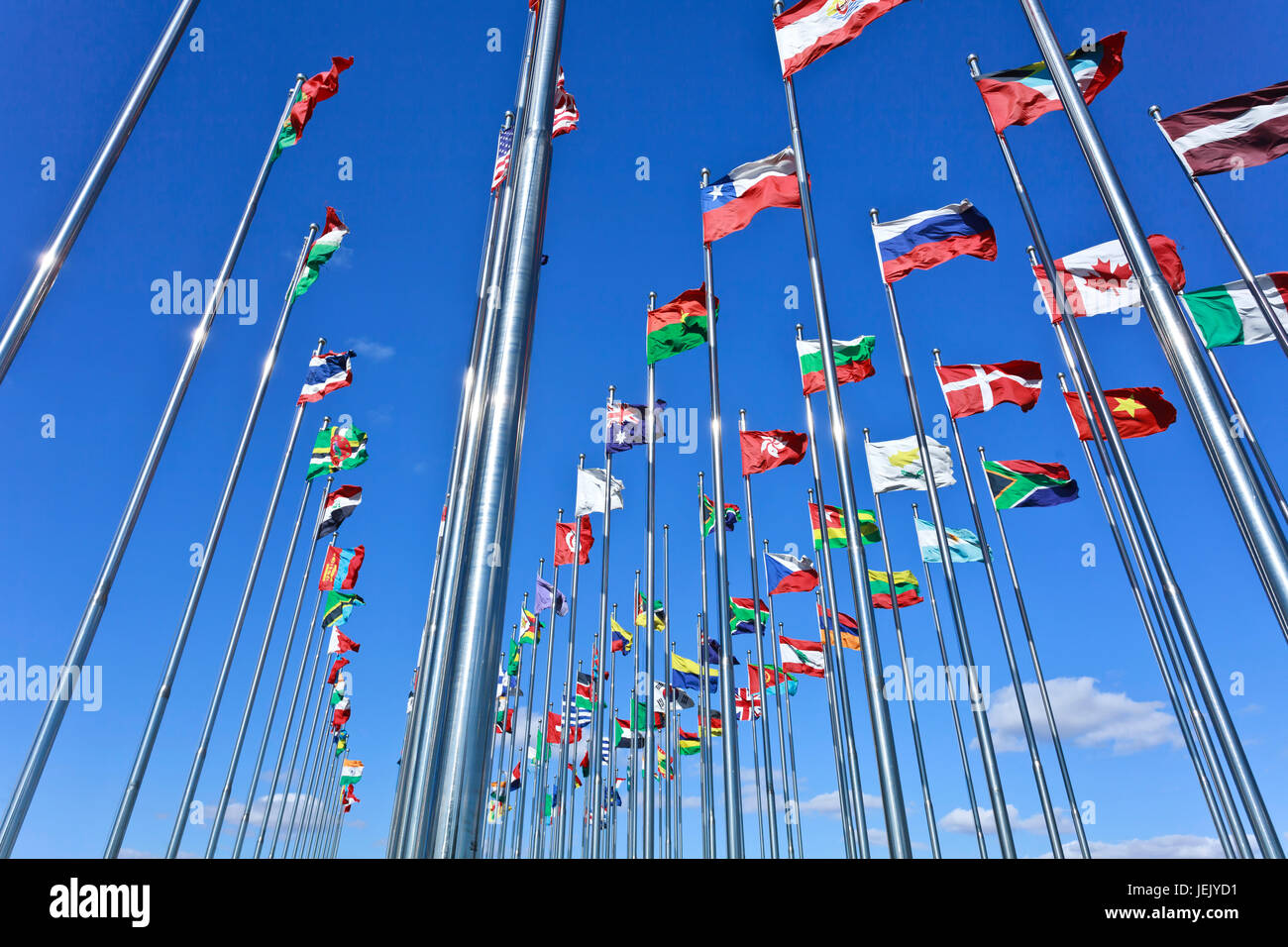Collection of international flags against a blue sky Stock Photo