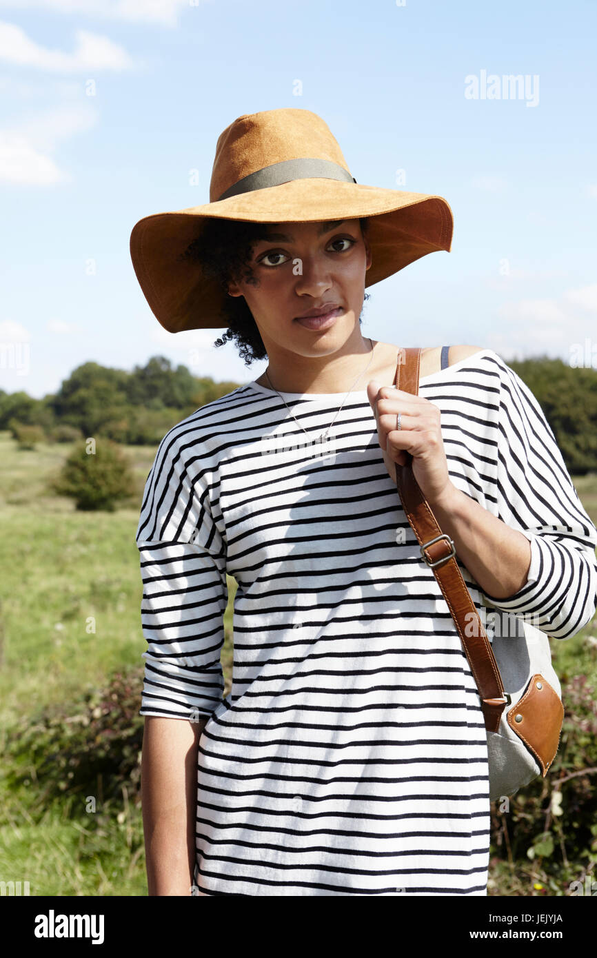 Portrait of young woman wearing hat Stock Photo - Alamy