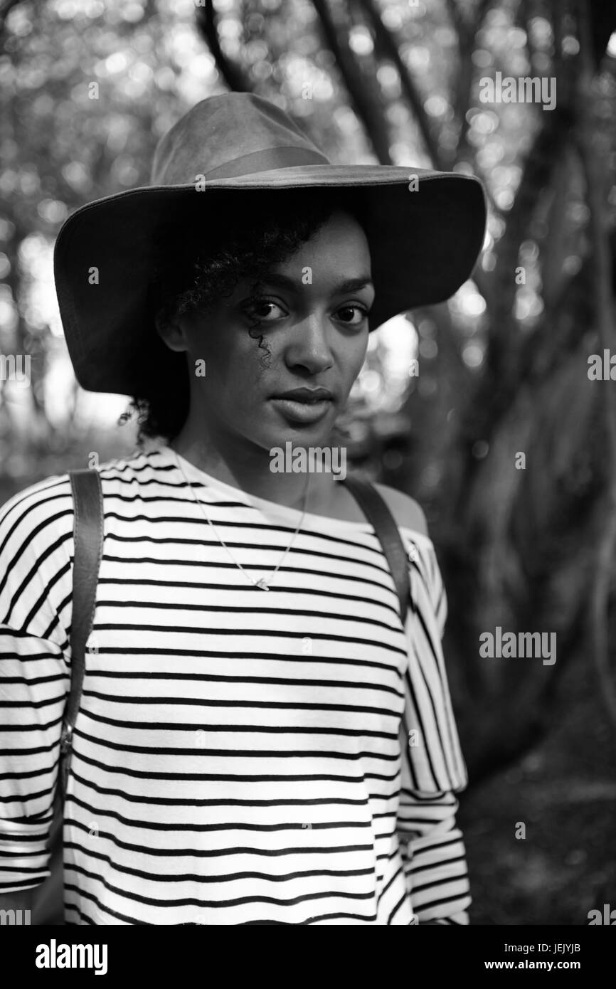 Portrait of young woman wearing hat Stock Photo - Alamy