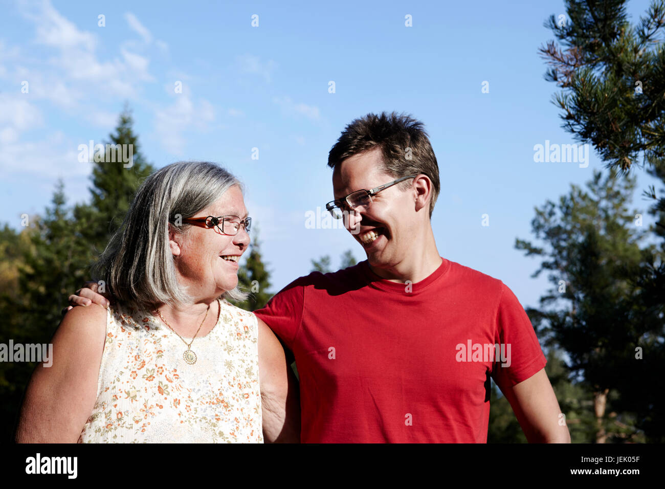 Portrait of senior woman with adult son Stock Photo