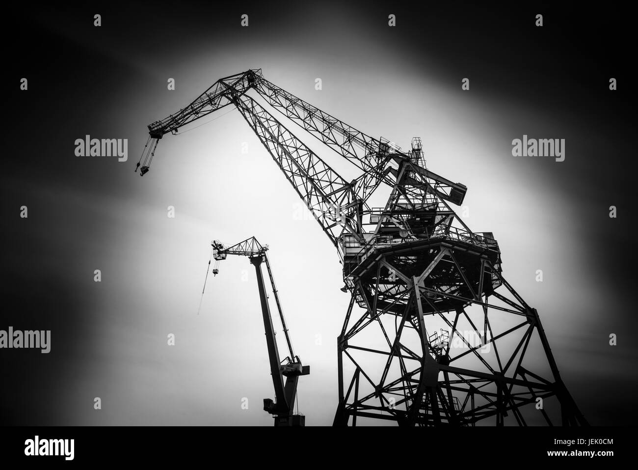 Low angle view of building cranes Stock Photo - Alamy