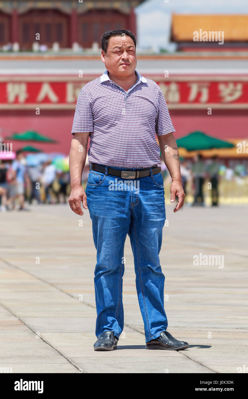 Overweight Chinese man on Tiananmen Square. The Changing Chinese life style has caused common overweight nationwide. Stock Photo