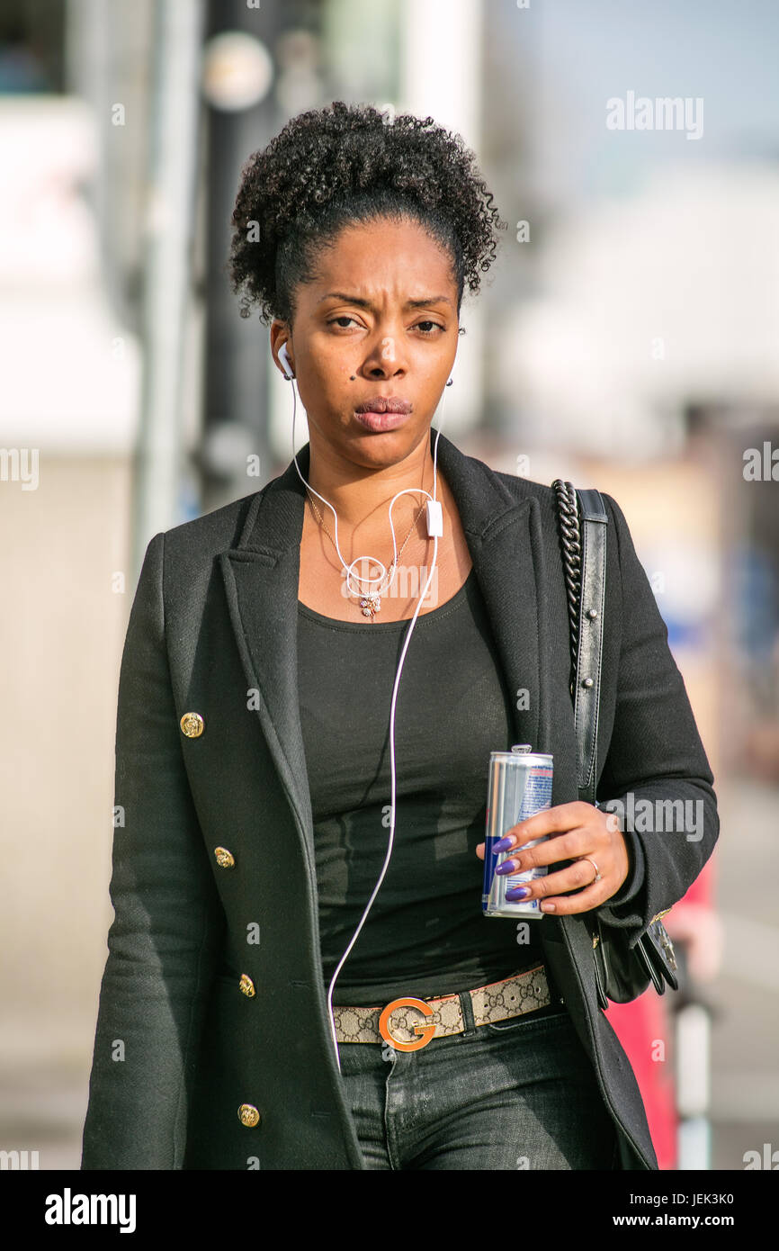 TILBURG-MARCH 10, 2017. Exotic girl with Red Bull drink. On the contrary of its previous multiculturalism, current Dutch cultural assimilation policie Stock Photo