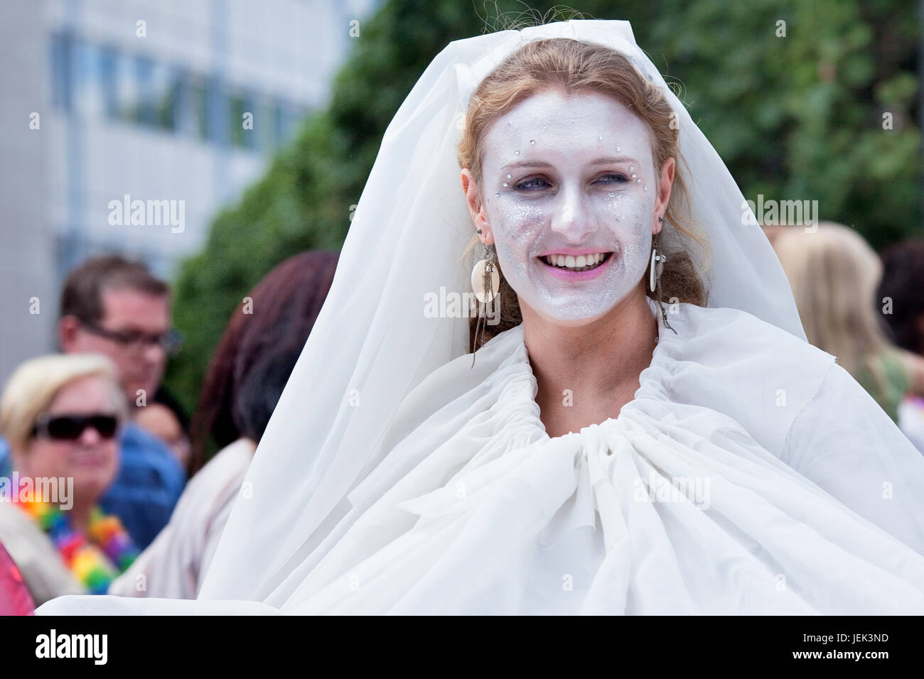 TILBURG, THE NETHERLANDS – JULY 3. Woman dressed in white participate at T-parade, a festival which aims people to demonstrates their culture. Stock Photo