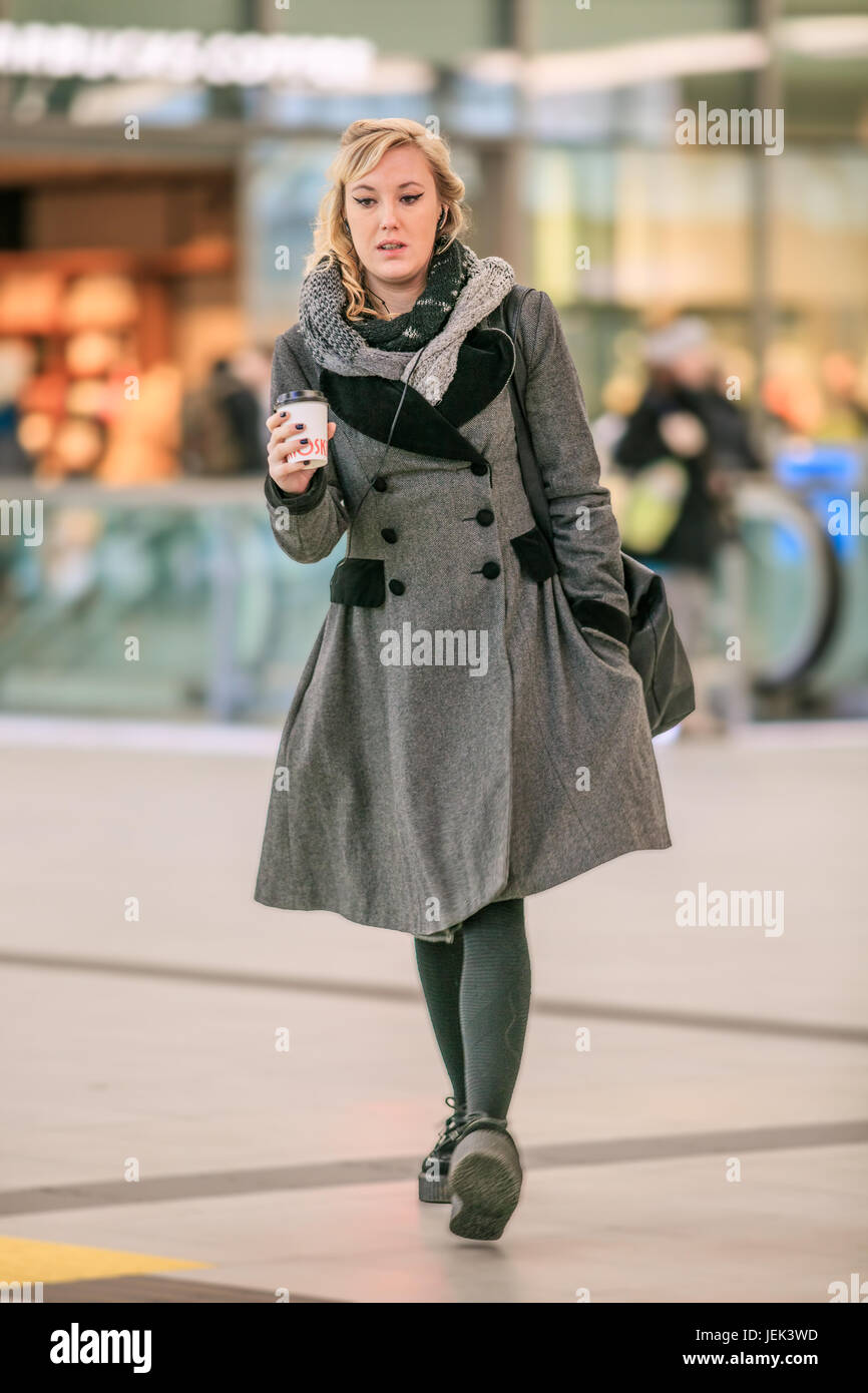 UTRECHT-MARCH 2, 2017. Young Dutch woman at Utrecht Central Railway Station, the largest and busiest railway station in the Netherlands. Stock Photo