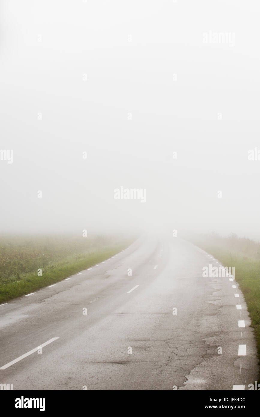 Country road at fog hi-res stock photography and images - Alamy