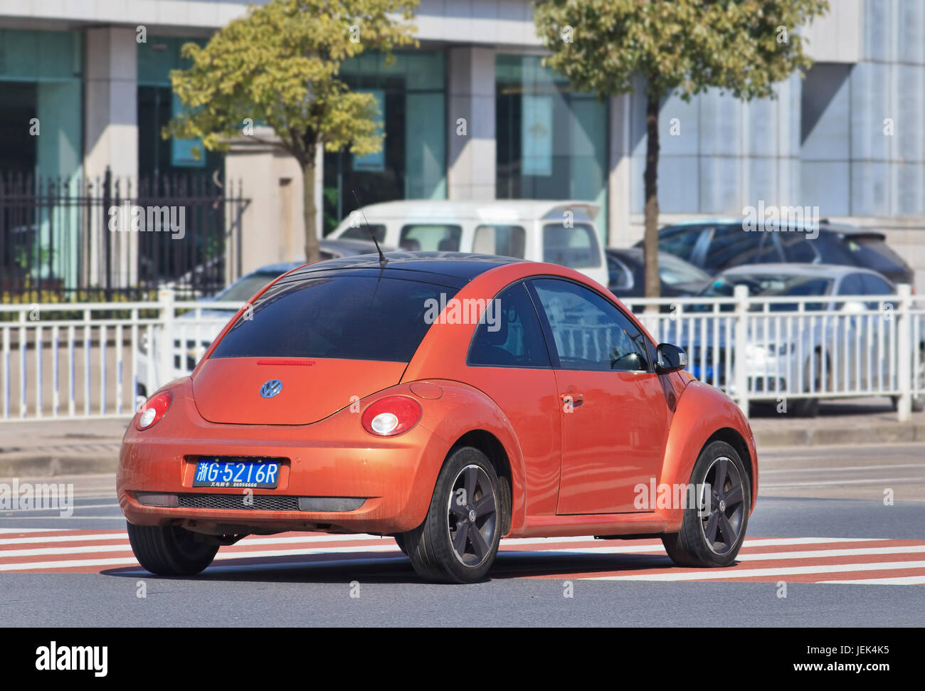 Orange Volkswagen Beetle. China is the place where VW CEO Matthias Mueller can enjoy brief respite from its worldwide diesel emissions scandal. Stock Photo