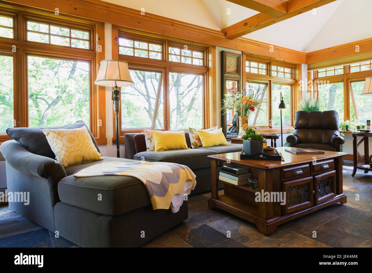 Sectional Sofa And Antique Wooden Coffee Table In The New