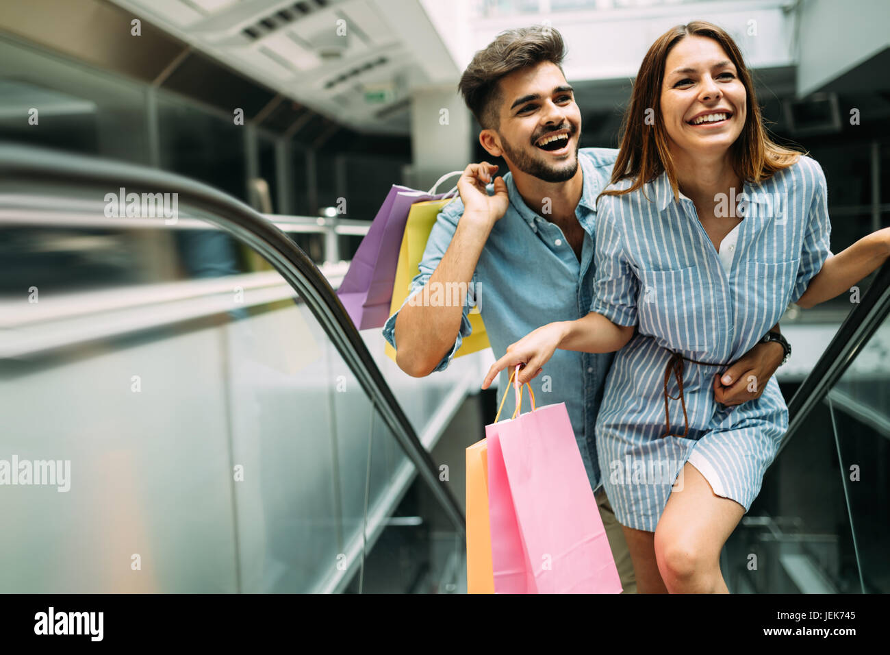 Happy attractive loving couple enjoy spending time in shopping together Stock Photo