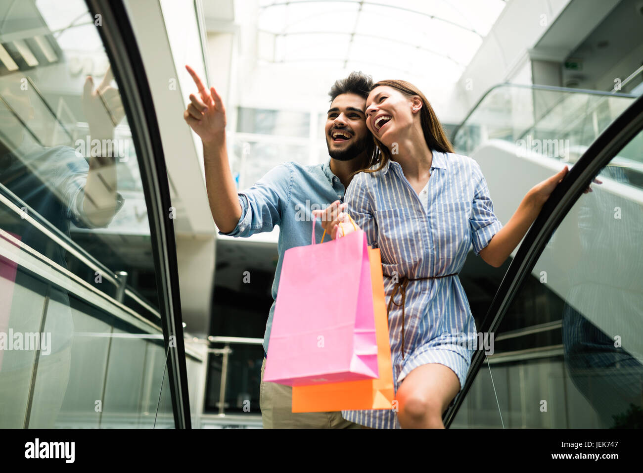 Happy attractive loving couple enjoy spending time in shopping together Stock Photo