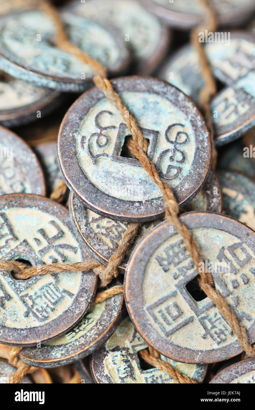 Tied antique Chinese coins displayed on Panjiayuan Market, located in south east Beijing, China. Stock Photo