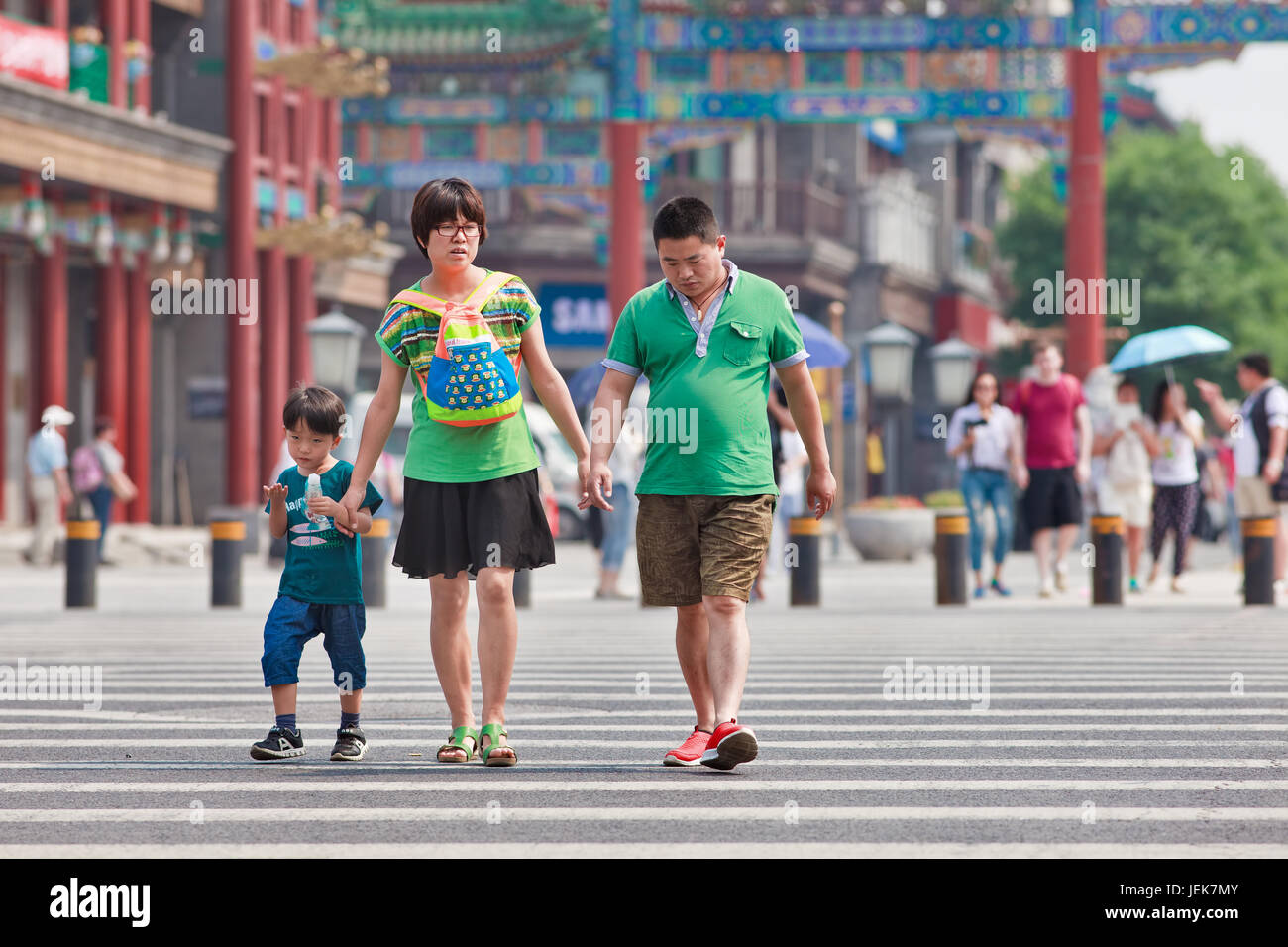 BEIJING-JUNE 9, 2015. Chinese couple with child. China’s one-child policy 1970s - early 1980s was to limit families have one child to reduce growth. Stock Photo