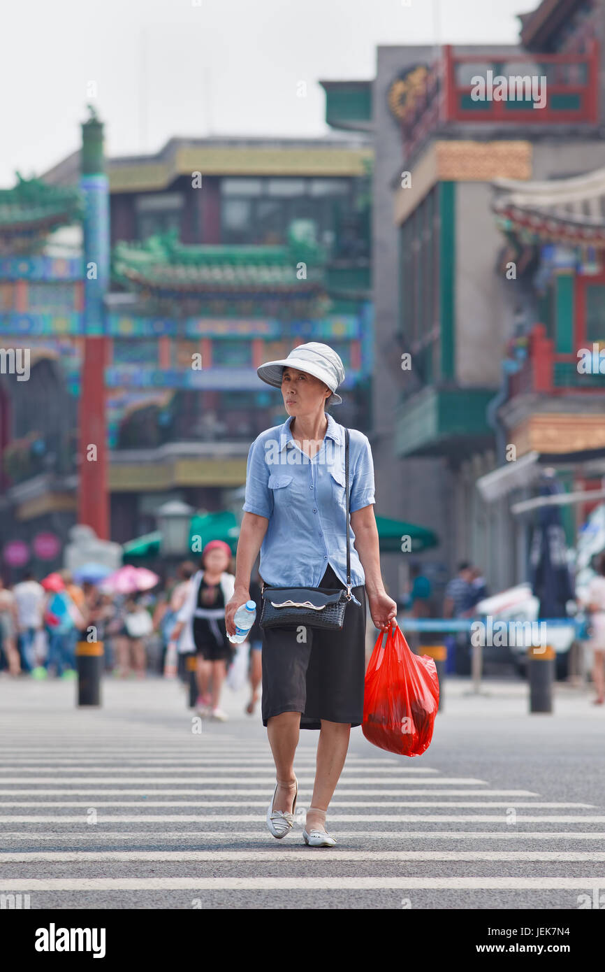 BEIJING-JUNE 9, 2015. Well-dressed elder woman. Elderly population (60 or older) in China is 128 million, one in every ten people, world’s largest. Stock Photo