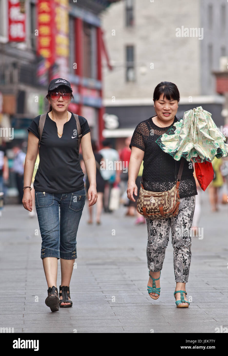 BEIJING-JUNE 9, 2015. Middle aged woman in Beijing center. Lives of women in China have significantly changed after government made great efforts. Stock Photo