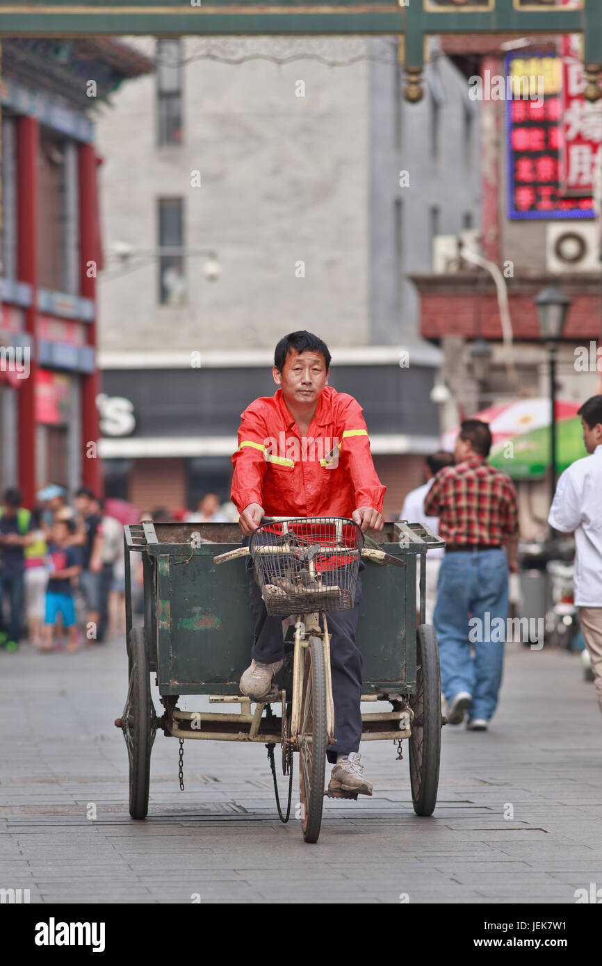 BEIJINGJUNE 9, 2015. Street sweeper on an old tricycle. China has a