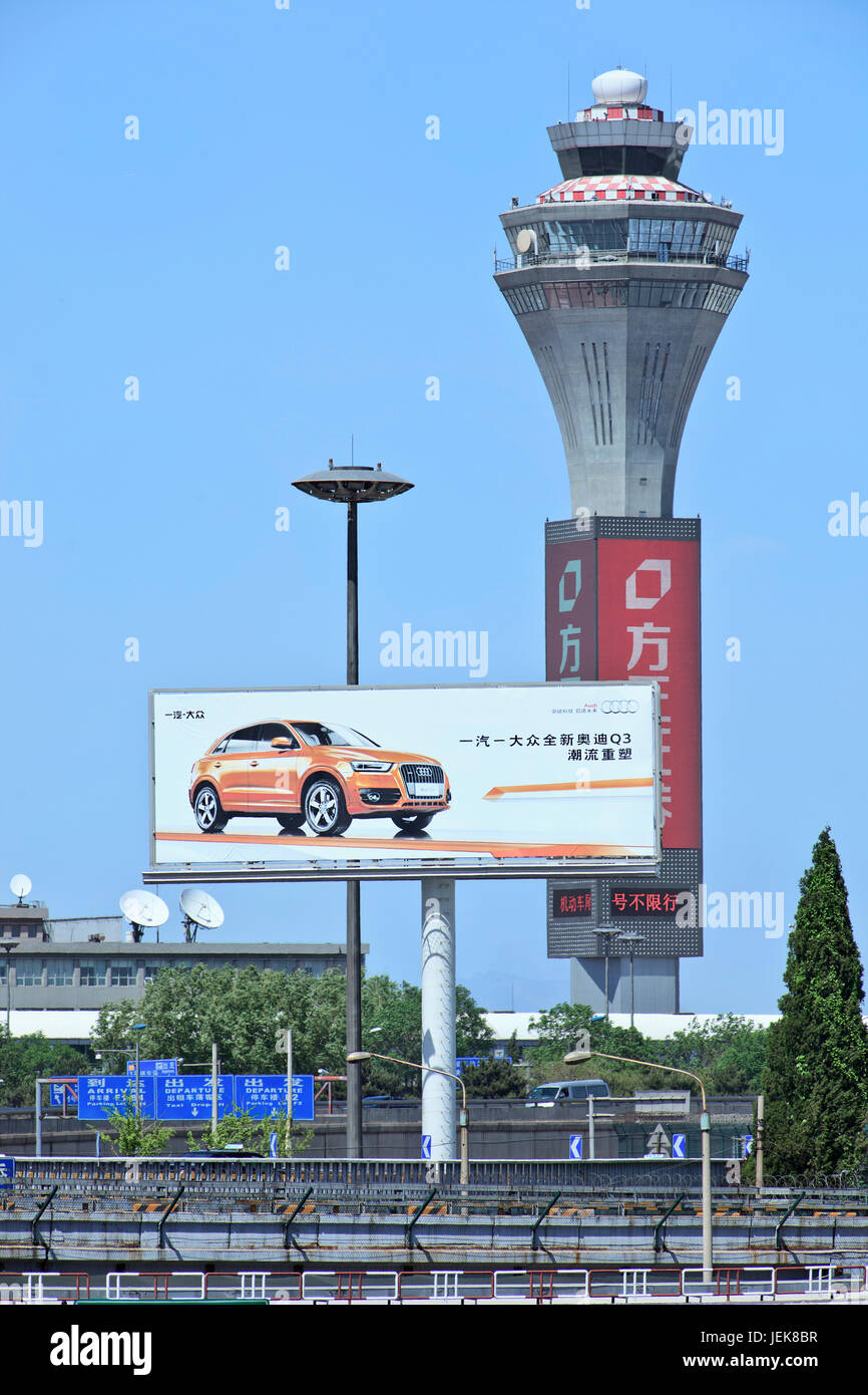 BEIJING-MAY 11. Billboard with Audi Q3 SUV ad near airport. Audi automobiles are sold in China by an exclusive dealer network. Stock Photo