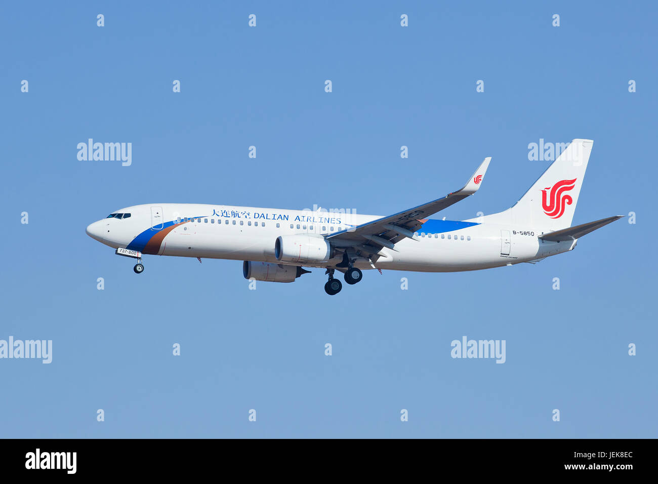BEIJING–MARCH 6, 2014. Dalian Airlines B-5850 Boeiing 737-89L landing in Beijing. The airplane is produced since 1996 by Boeing. Stock Photo