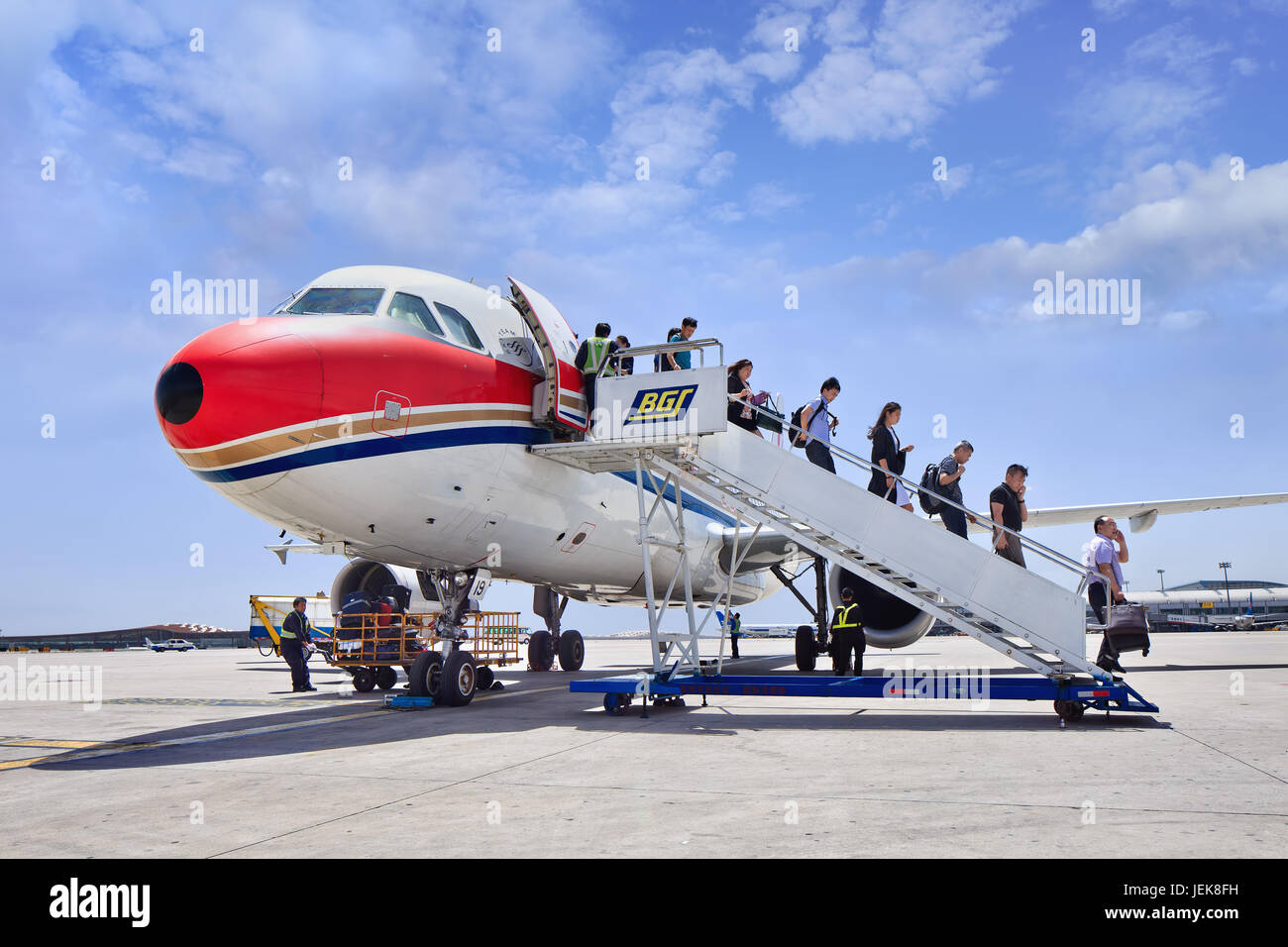 BEIJING-MAY 27, 2014. Passengers come out airplane on Beijing Airport. China's economy is now the world's second biggest. Stock Photo