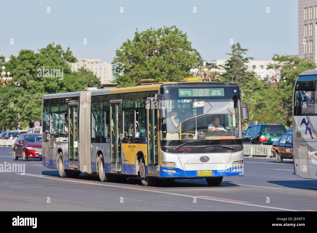 BEIJING-MAY 29, 2013. Bendi on Chang an Avenue. In 2013, the state-owned Beijing Public Transport Holdings, operated 1,020 bus routes, 22,555 buses an Stock Photo