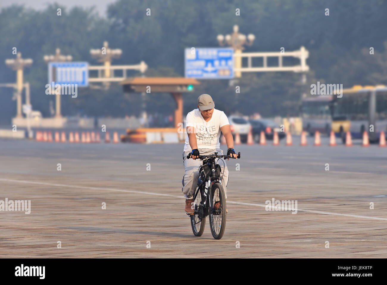 BEIJING-JUNE 1, 2013. Bicycle commuter at early morning. Although cycling has been taken over by car, growing number of Beijing commuters cycle again. Stock Photo