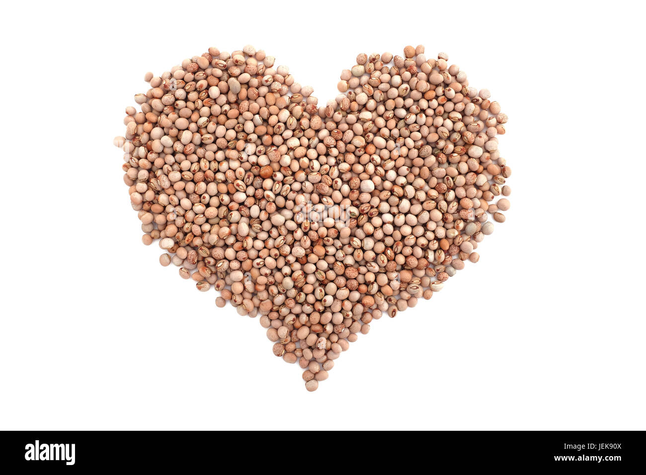 Dried pigeon peas in a heart shape, isolated on a white background Stock Photo