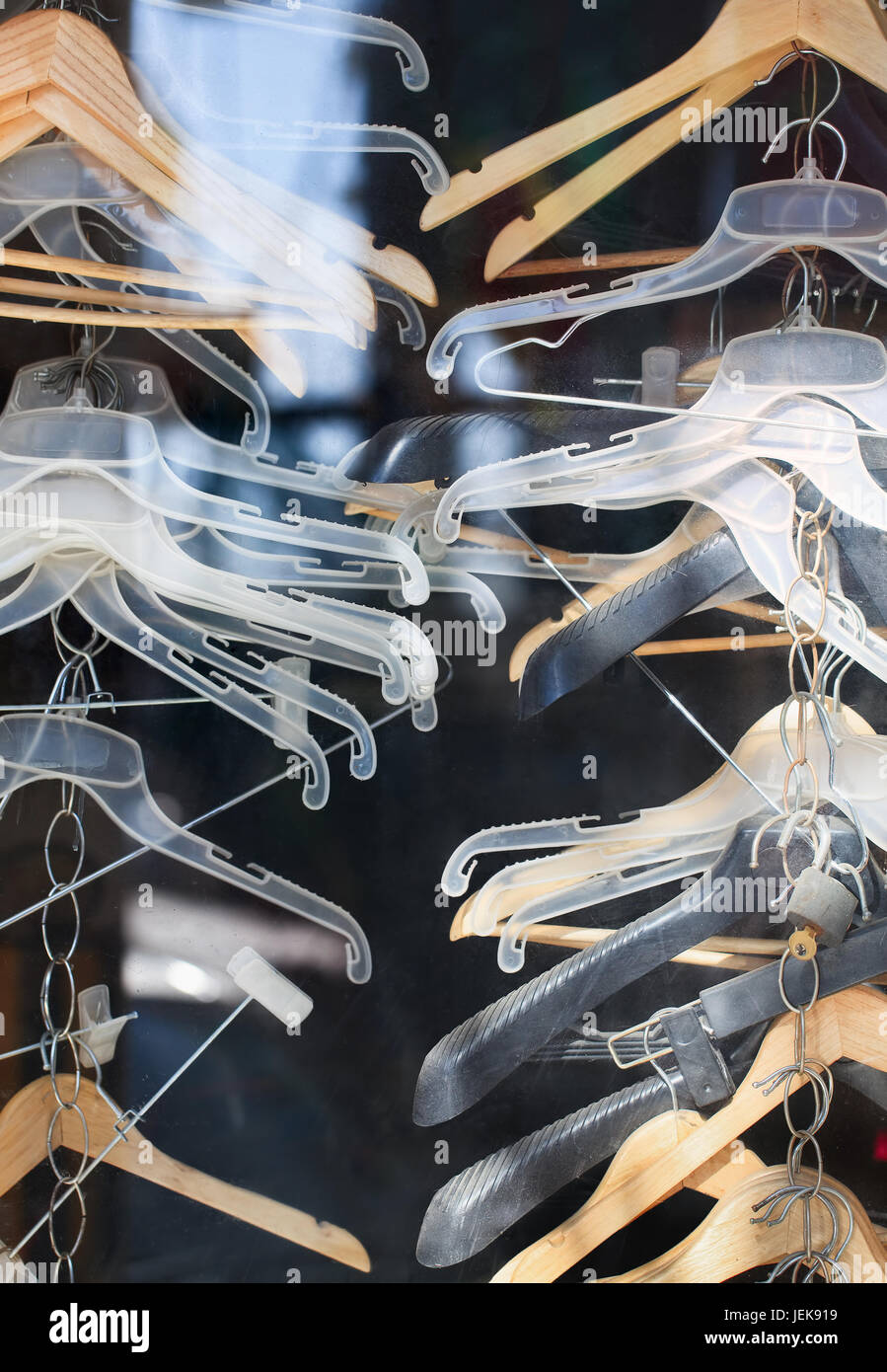 Collection plastic, metal and wooden clothes hangers Stock Photo