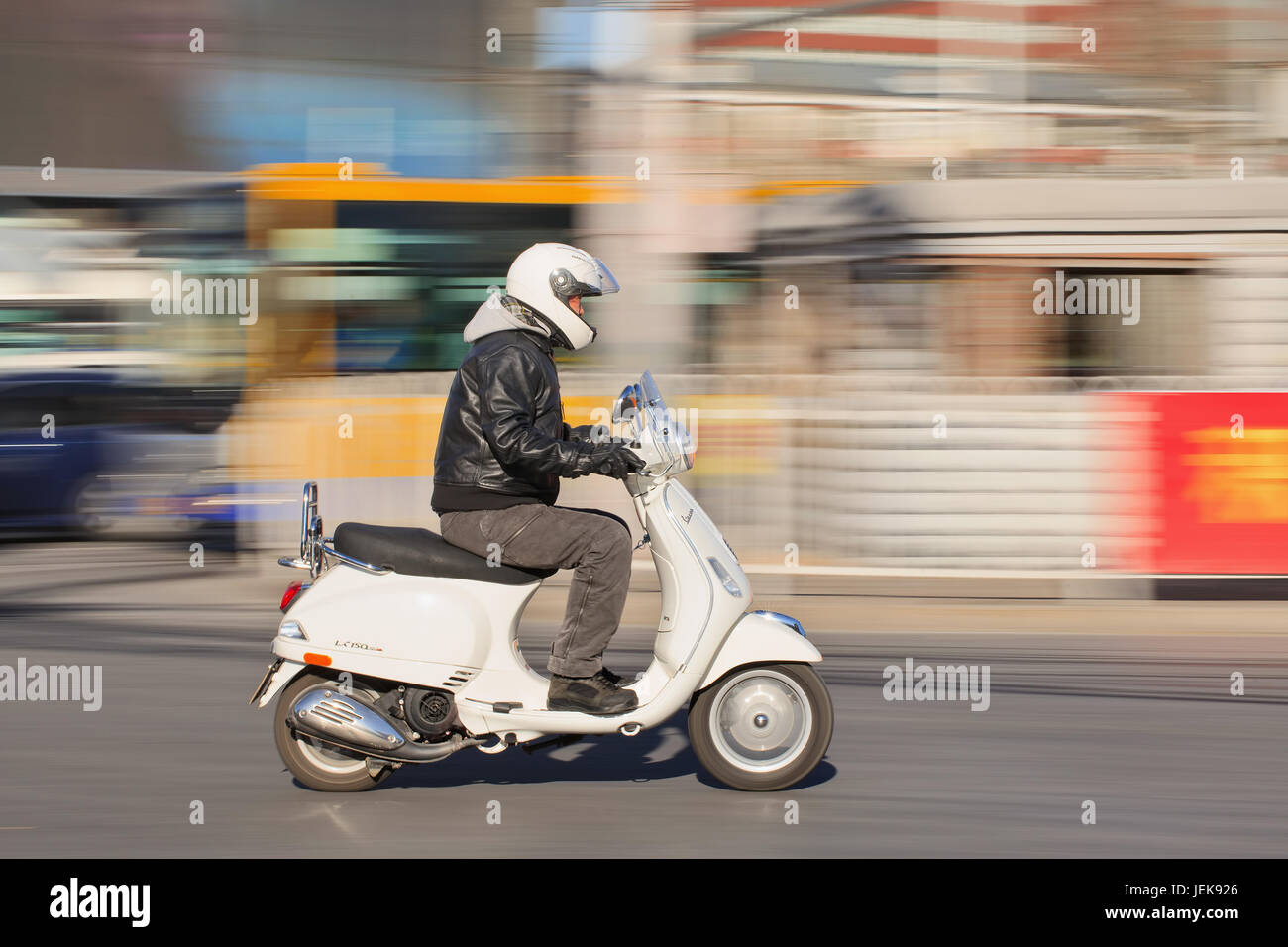 BEIJING-DEC. 5, 2015. Man on Vespa scooter LS 150. The LX scooters were launched in US in 2006 (60th anniversary Vespa), while S was added in 2008. Stock Photo