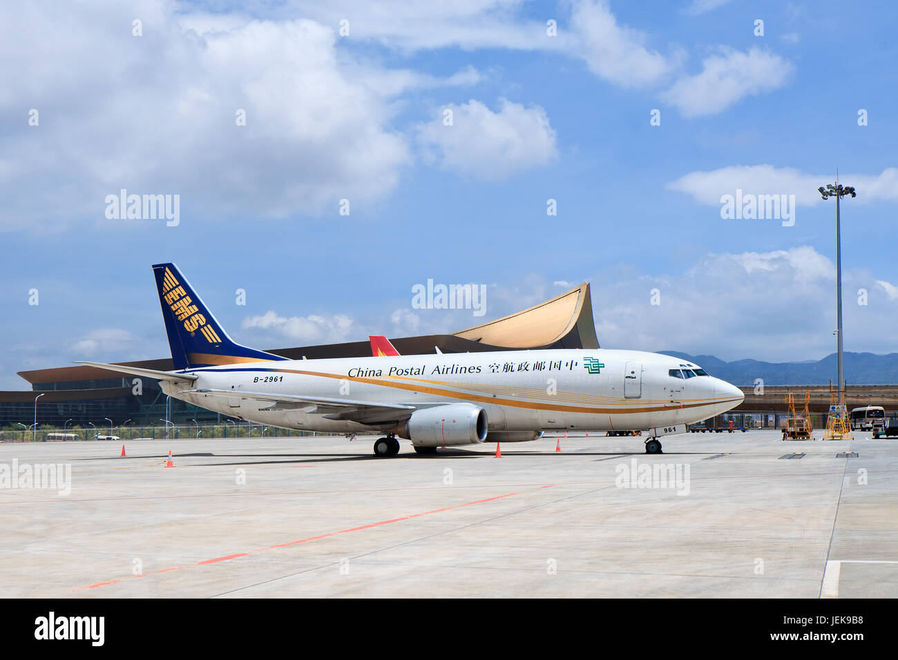 KUNMING-JUNE 30, 2014. Boeing 737-300 from China Postal Airlines parked at Kunming Changshui International Airport. Stock Photo