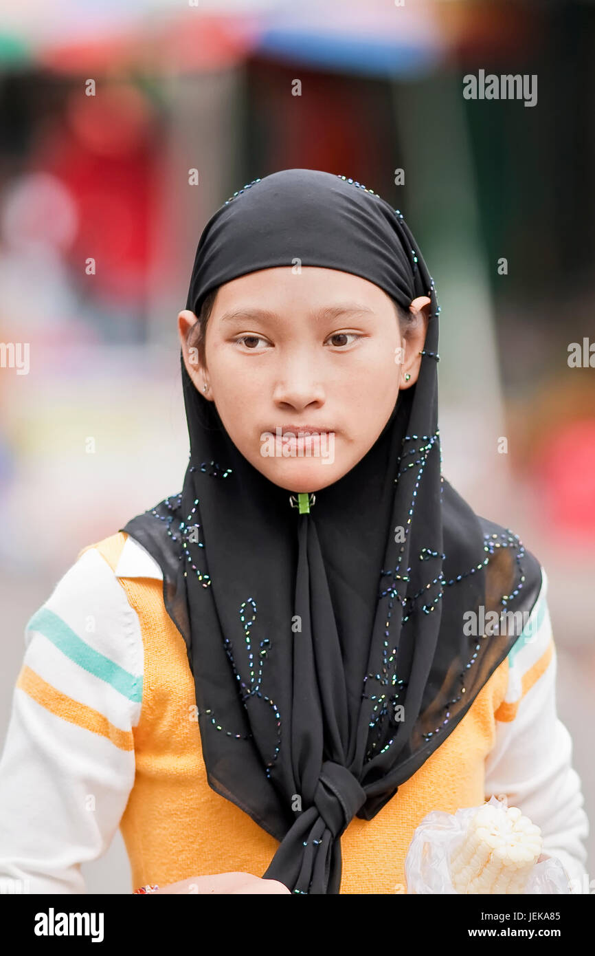 HAINAN - CHINA, JAN 16, 2008. Young muslim girl with a headscarf in Sanya, Hainan, China on January 16, 2008. Stock Photo